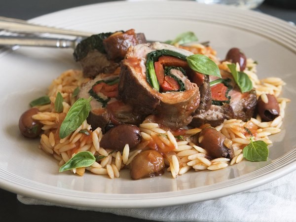 Braised veal rolls with pasta and olives