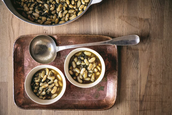 Braised white beans with charred spinach