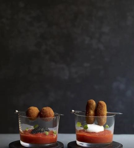 Brandade croquettes and serrano ham croquettes with fresh tomato puree and Cabrales espuma