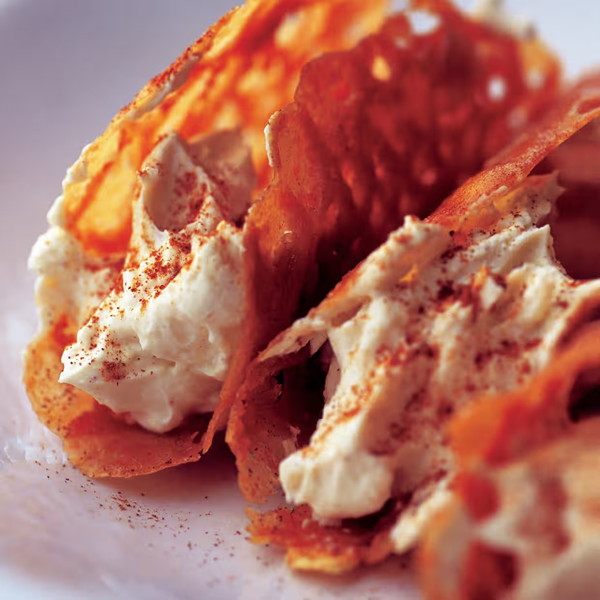 Brandy snaps with cinnamon cream