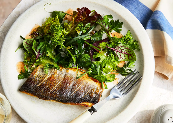 Branzino with mesclun and tomato-herbes de Provence vinaigrette