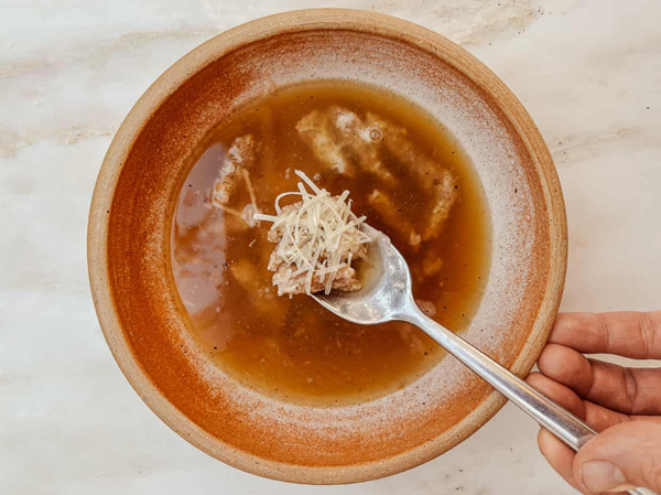 Bread and cheese pasta in broth (passatelli in brodo)