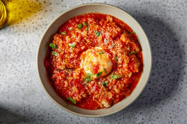 Bread and tomato soup with poached eggs (Acquacotta)