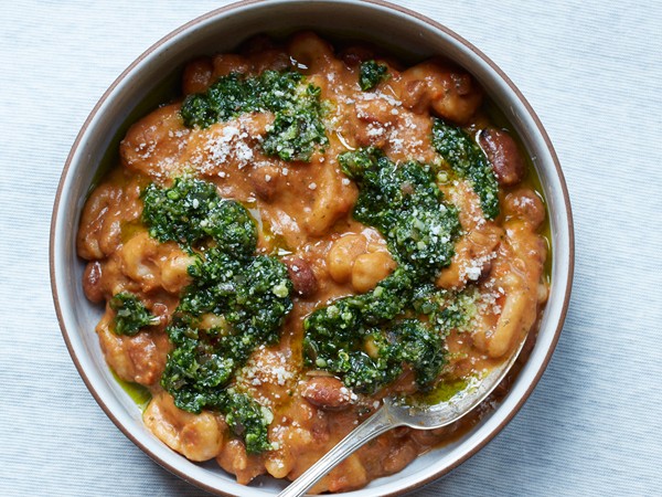 Bread crumb dumplings and bean stew with parsley-speck pesto