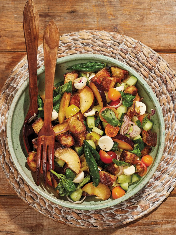 Bread salad with tomatoes, plums, cucumbers and mozzarella with mint & basil