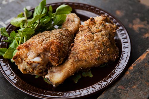 Breaded and baked chicken drumsticks