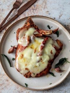 Breaded pork cutlet with prosciutto and cheese (Cotoletta alla Bolognese)