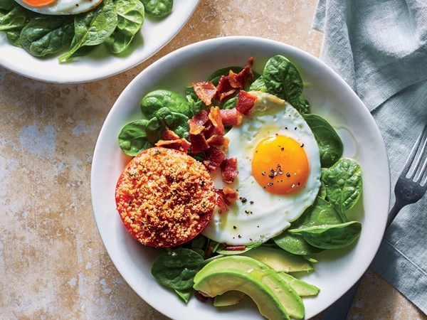 Breakfast bowl with tomato, avocado, and egg