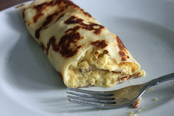 Breakfast crêpes with eggs, bacon and cheese
