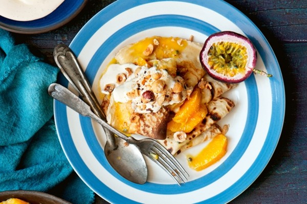 Breakfast crepes with orange & passionfruit compote