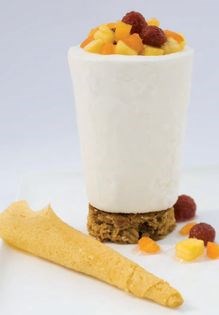 Breakfast for dessert—yogurt ice cream on granola cookie with fresh fruit