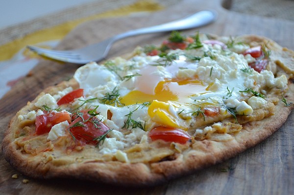 Breakfast pizza with hummus, tomato, feta, and dill