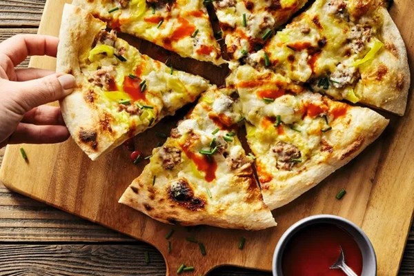 Breakfast pizza with sausage, egg & pickled banana peppers