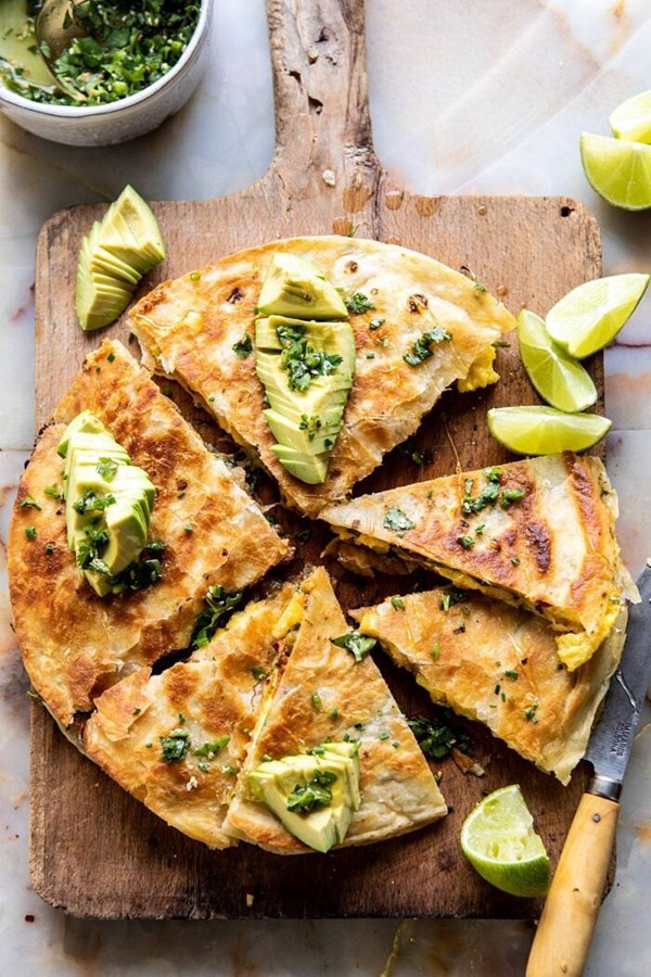 Breakfast quesadilla with soft scrambled eggs and avocado salsa