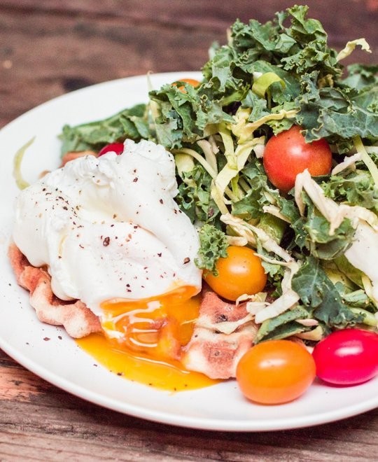 Breakfast salad with a pizza crust waffle