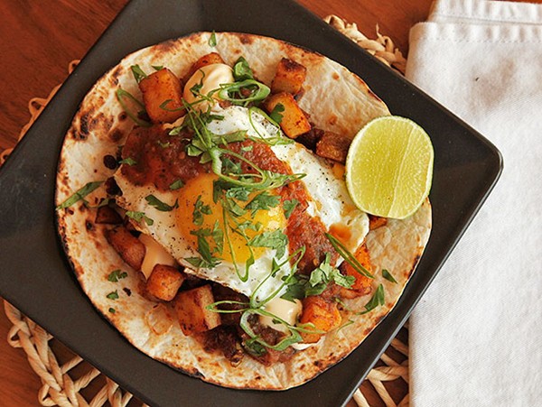 Breakfast tacos with crispy potatoes, chorizo, and fried egg
