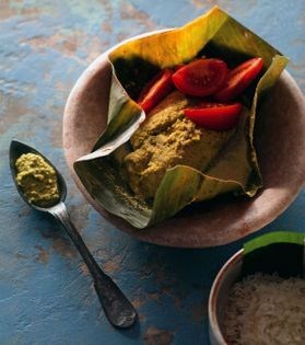 Bream in green chatni steamed in banana leaves