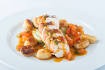 Breast of chicken with potato gnocchi, courgette ribbons and a tomato and olive sauce