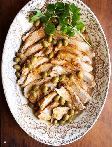 Breast of veal braised with green olives and tomatoes
