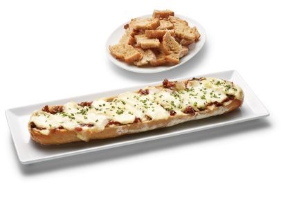 Brie-onion dip in a French bread bowl