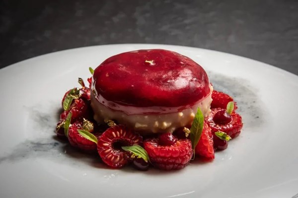 Brillat-Savarin cheesecake with spiced biscuits, raspberries and lemon verbena