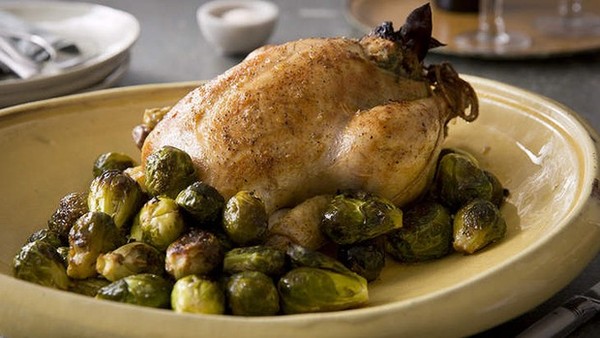 Brined and stuffed roast chicken with honeyed Brussels sprouts 