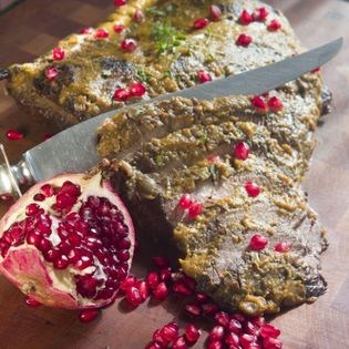 Brisket braised in pomegranate juice with onion confit and pomegranate seeds