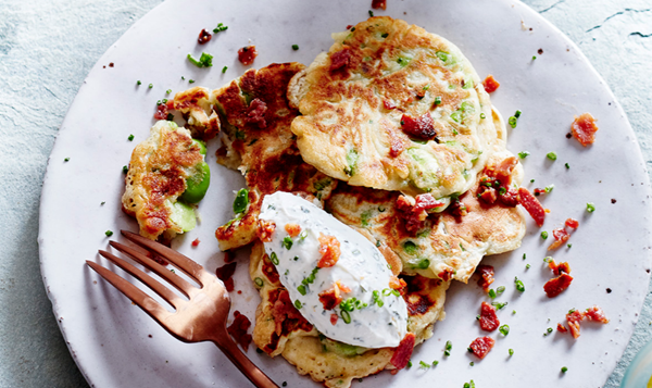 Broad bean fritters with herby whipped goat's cheese and bacon crumbs
