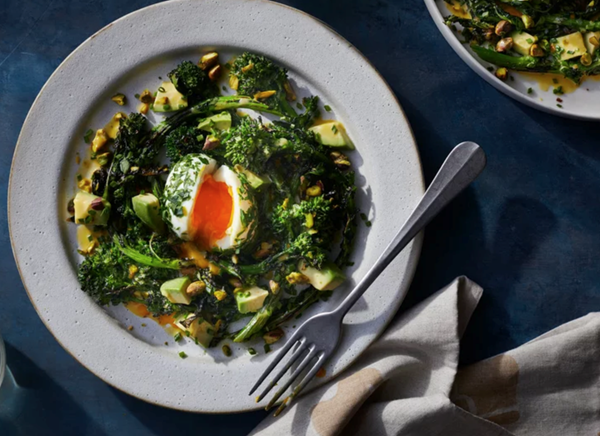 Broccoli rabe and avocado salad with lemon dressing and herby molten eggs