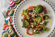 Broccoli with roasted peppers, feta, olives, and herbs