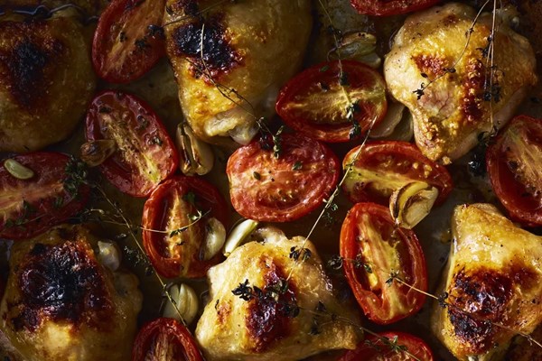 Broiled chicken thighs with plum tomatoes & garlic