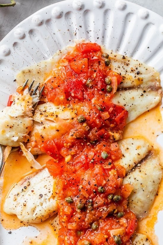 Broiled fish with tomato caper sauce