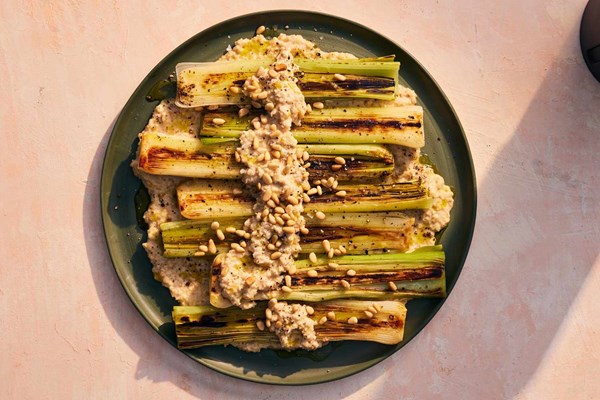 Broiled leeks with toasted pine nut sauce