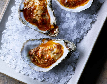 Broiled oysters with slow-roasted tomato butter
