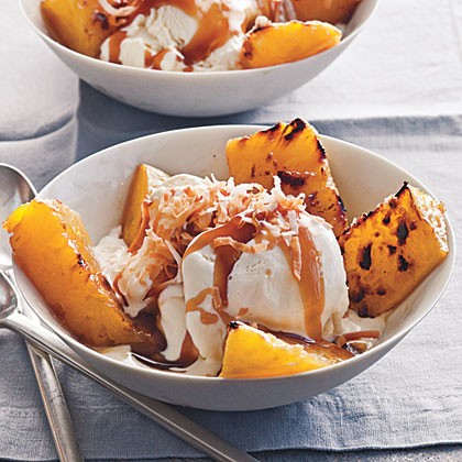 Broiled pineapple with bourbon caramel over vanilla ice cream