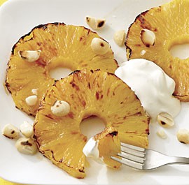 Broiled pineapple with lime sour cream and macadamias