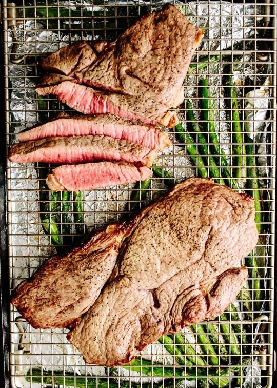 Broiled steak & asparagus with feta cream sauce