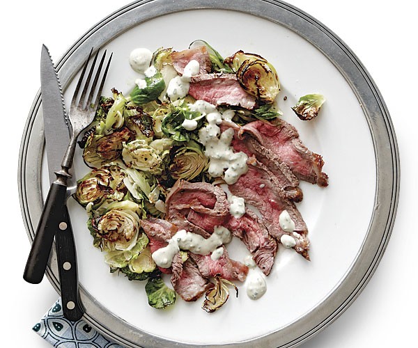 Broiled steak and Brussels sprouts with blue cheese sauce