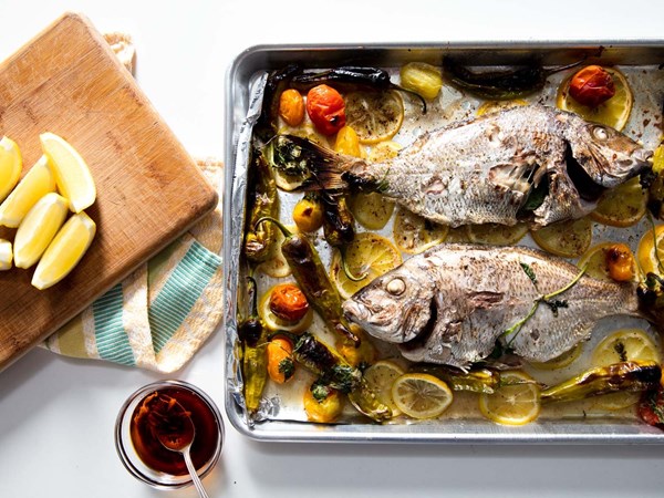 Broiled whole porgy with blistered shishito and tomato