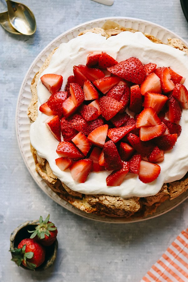 Brown butter hazelnut cake with fresh berries and whipped cream