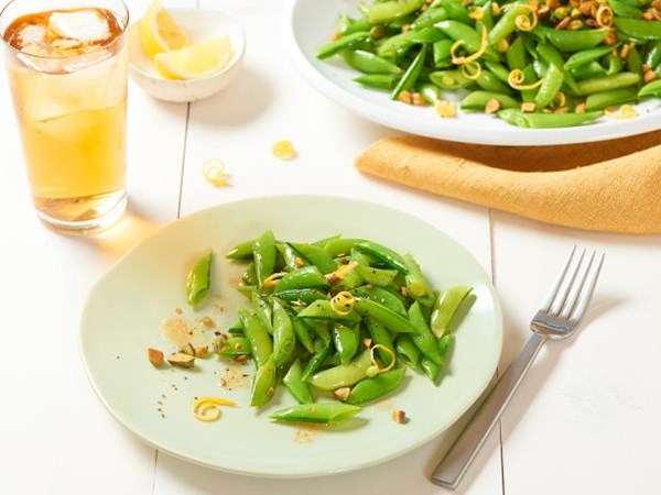 Brown butter-sautéed snap peas with pistachios and lemon zest