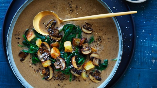 Brown mushroom and spinach soup with potato croutons