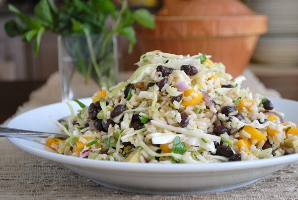 Brown rice, black bean, and cabbage salad with mango and avocado