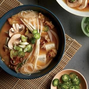 Brown rice noodle bowls with tofu, pork, and kimchi
