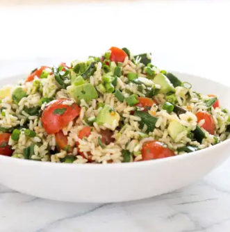Brown rice salad with jalapeño, tomatoes, and avocado