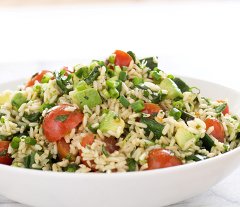 Brown rice salad with jalapeños, tomatoes, and avocado