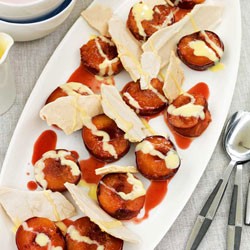 Brown sugar meringue shards, roasted plums and white chocolate sauce