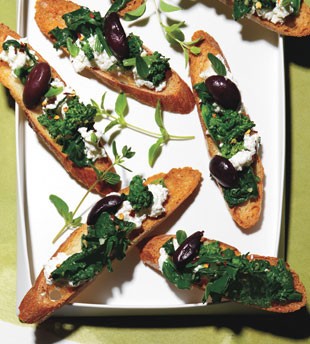 Bruschetta with kalamata olives, braised greens, and ricotta