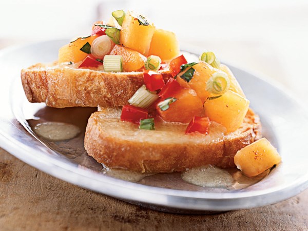 Bruschetta with peach salsa and melted brie