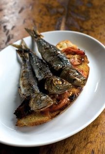 Bruschetta with roast tomatoes and grilled sardines